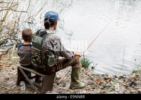 Man and his grandson fishing Stock Photo