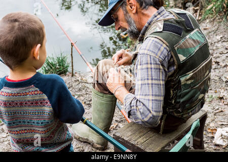 Man and his grandson fishing Stock Photo