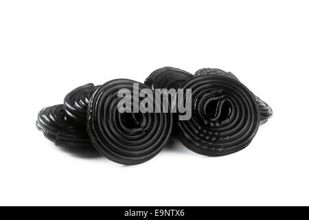 Licorice wheels candies isolated on white background. Candy flavored licorice. Stock Photo