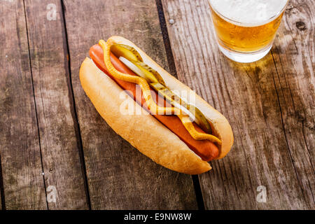 hot dog with mustard, pickles and onions Stock Photo