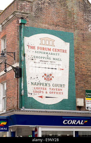 Hand painted advertising sign on brick wall Stock Photo