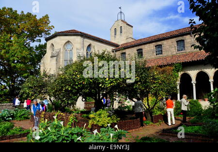 NYC:  Visitors exploring the herb garden with more than 250 different species of plants in the Bonnefont Cloister