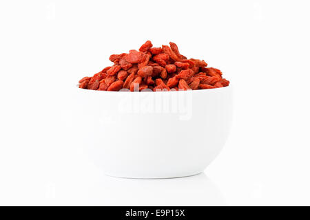 Goji berries in a cup on white background Stock Photo