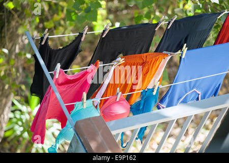 Clothes dried on balcony of a house in Italy Stock Photo