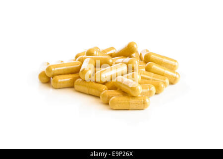 A pile of supplement capsules on a white background Stock Photo
