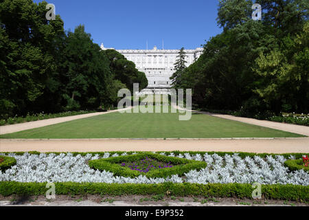 Flower bed in Campo de Moro gardens / Jardines del Palacio Real, Royal Palace behind, Madrid, Spain Stock Photo