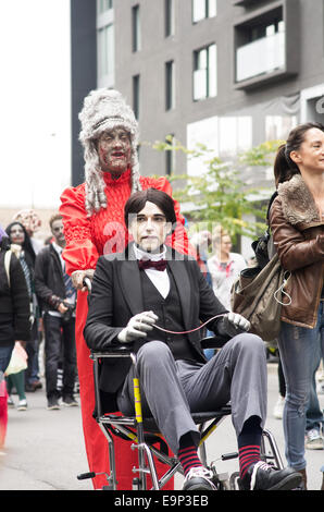 Participants walk around dressed as zombies and have zombie makeup at Montreal Zombie Walk 2014 edition Stock Photo