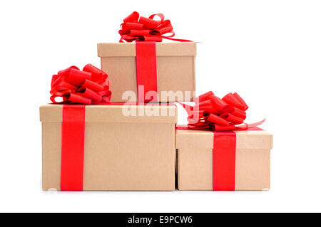 some cardboard gifts boxes with red ribbon bows on a white background Stock Photo