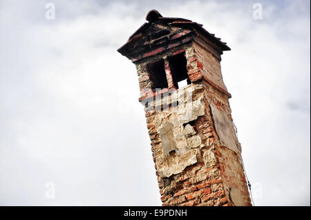 Architecture detail with very old brick smoking chimney Stock Photo