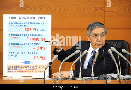 Tokyo, Japan. 31st Oct, 2014. Haruhiko Kuroda, governor of the Bank of Japan (BOJ), attends a press conference at BOJ headquarters in Tokyo, Japan, Oct. 31, 2014. BOJ decided to buy Japanese government bonds from financial institutions so that their amount outstanding will increase at an annual pace of about 80 trillion yen (731.28 billion dollars). © Stringer/Xinhua/Alamy Live News Stock Photo