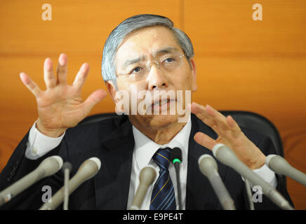 Tokyo, Japan. 31st Oct, 2014. Haruhiko Kuroda, governor of the Bank of Japan (BOJ), attends a press conference at BOJ headquarters in Tokyo, Japan, Oct. 31, 2014. BOJ decided to buy Japanese government bonds from financial institutions so that their amount outstanding will increase at an annual pace of about 80 trillion yen (731.28 billion dollars). © Stringer/Xinhua/Alamy Live News Stock Photo
