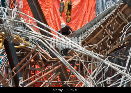 Jakarta, Indonesia. 31st Oct, 2014. A rescuer searches for victims during an operation in Jakarta, Indonesia, Oct. 31, 2014. It is believed that an archive building collapsed on Friday morning, causing four construction workers died, five workers seriously injured and two members of a rescue team slightly injured when searching victims. Credit:  Veri Sanovri/Xinhua/Alamy Live News Stock Photo