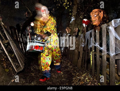 Montreal, Canada. 30th Oct, 2014. A volunteer in frightening costume is seen in the Halloween Haunted Woods on the Mohawk reserve of Kahnawake near Montreal, Canada, Oct. 30, 2014. More than 10 volunteers wearing frightening costumes scare and entertain visitors during the Halloween season here. The two-day activity also collects food and donations for the local food bank. Credit:  Andrew Soong/Xinhua/Alamy Live News Stock Photo