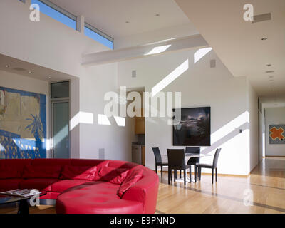 Red leather sofa and breakfast table in Sharpe Residence, Somis, California, USA. Stock Photo