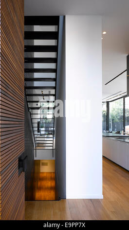 Staircase and pillar with wood cladding in UP House, Hertzelia, Israel. Stock Photo