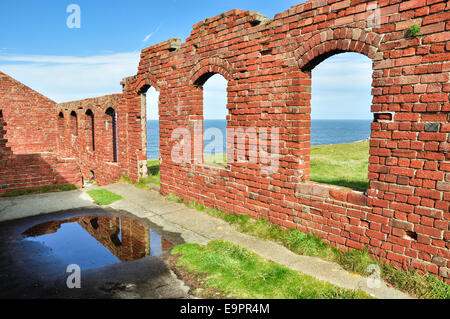 Red brick buildings. Ruins from the industrial activity at Porthgain in Pembrokeshire. Stock Photo
