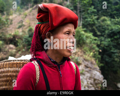 Woman from Red Dao minority group wearing traditional headdress near Ban Ho village, Sapa District, Lao Cai, Vietnam. Stock Photo