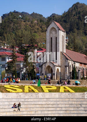 The Holy Rosary church and people around the main square of Sapa town, Lao Cai Province, Vietnam. Stock Photo
