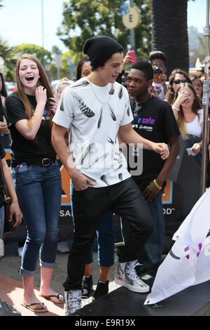 Austin Mahone seen at Universal Studios where he was interviewed by Mario Lopez for television show Extra.  Featuring: Austin Mahone Where: Los Angeles, California, United States When: 28 Apr 2014 Stock Photo