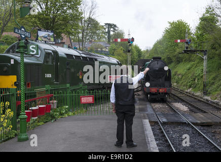 Steam train approaching Alresford railway station on the WaterCress Line in New Alresford, Hampshire, England, UK Stock Photo