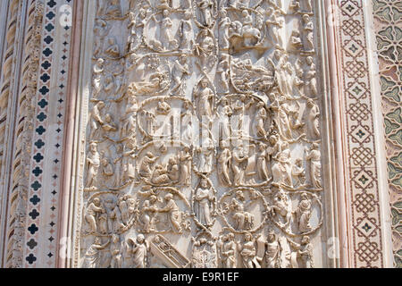 Orvieto, Umbria, Italy. Bas-relief depicting the Tree of Jesse and scenes from the Old Testament on façade of the cathedral. Stock Photo