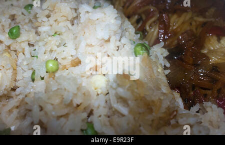 Egg fried rice with peas and Singapore noodle. Stock Photo