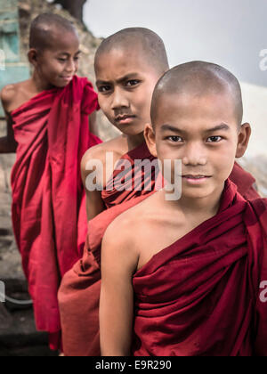 Novice Buddhist monks outside Buddhist temple on in Bagan, Myanmar (Burma). Stock Photo