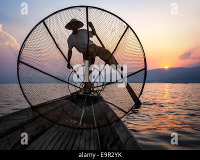 Fisherman in Inle Lake at sunset, Inle, Shan State, Myanmar