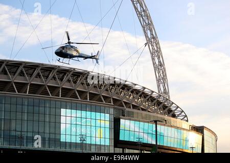 A helicopter stunt is used as part of the filming for 24 TV series at Wembley Football Stadium  Featuring: Atmosphere Where: London, United Kingdom When: 28 Apr 2014 Stock Photo