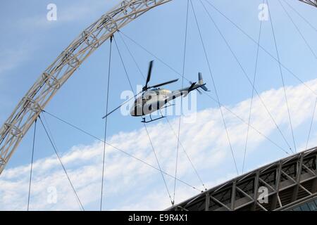 A helicopter stunt is used as part of the filming for 24 TV series at Wembley Football Stadium  Featuring: Atmosphere Where: London, United Kingdom When: 28 Apr 2014 Stock Photo