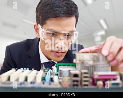 man fixing computer Stock Photo