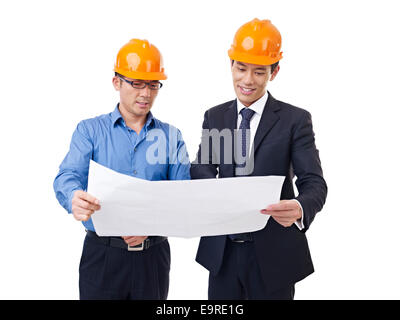 businesspeople with architectural drawing Stock Photo