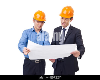 businesspeople with architectural drawing Stock Photo