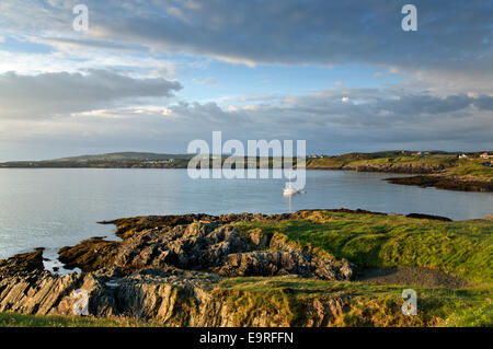 View across Bull Bay (Port Llechog) to Amlwch seen from the coastal path  looking east towards Amlwch on northern coast Stock Photo