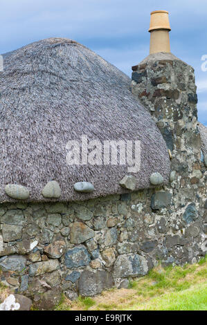 Tourist attraction Skye Museum of Village Life depicts thatched stone cottages in ancient crofting housing at Kilmuir, Isle of S Stock Photo