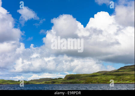 Puffy white Cumulus cloud formation above Dunvegan Loch, Isle of Skye, Western SCOTLAND Stock Photo