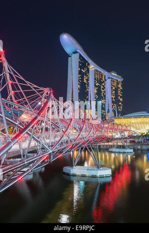 Marina Bay Sands Hotel and the Double Helix Bridge at night, Singapore Stock Photo