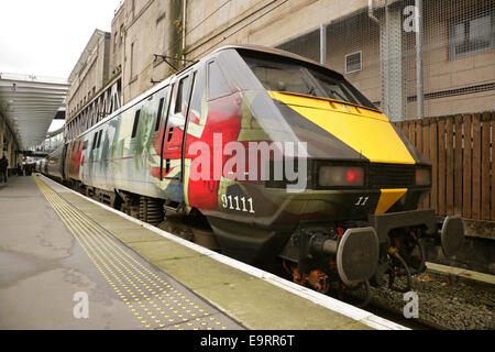 Edinburgh Waverley railway station, UK, 31 October 2014. East Coast Trains' Class 91 locomotive number 91111, which works the East Coast Main Line Edinburgh-London route, has been named 'For the Fallen', with a commemorative livery applied in advance of Remembrance Day, 11 November. The unique livery includes images of Flanders poppies, soldiers, horses, barbed wire and letters home. Credit:  david soulsby/Alamy Live News Stock Photo