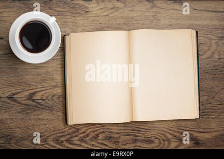 open book and coffee cup top view on table Stock Photo