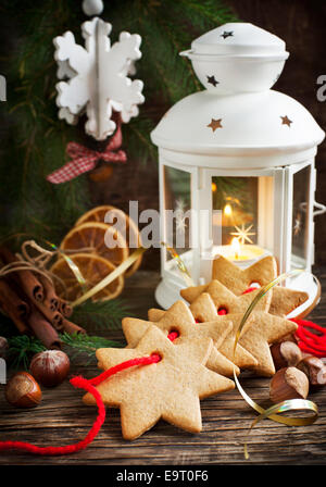 Christmas composition with gingerbread and candle Stock Photo