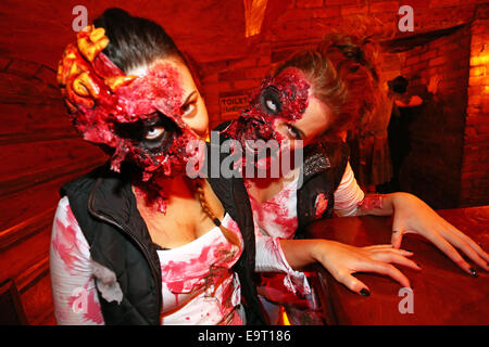 London, UK. 1st November 2014. People dressed up as Zombies at the 8th annual London Zombie Walk 2014 celebrating Halloween with a pub crawl round the pubs of central London, starting at Waxy O'Connors in Soho. Credit:  Paul Brown/Alamy Live News Stock Photo