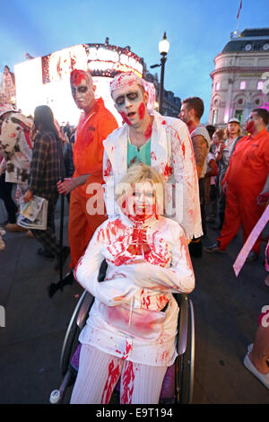London, UK. 1st November 2014. People dressed up as Zombies at the 8th annual London Zombie Walk 2014 celebrating Halloween with a pub crawl round the pubs of central London, starting at Waxy O'Connors in Soho. Credit:  Paul Brown/Alamy Live News Stock Photo