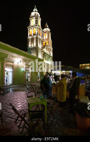Night shot of street vendors selling food in the square in front of the Campeche Cathedral, Campeche, Mexico. Stock Photo