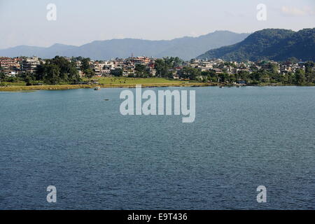 The 5.23 km2 Phewa tal-lake with Pokhara town on the background at the foot of the Annapurnas range. Kaski district-Gandaki zone Stock Photo