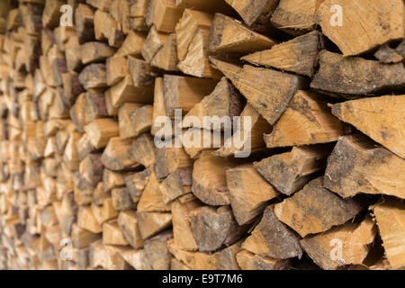 Side view of stacked logs prepared for winter Stock Photo