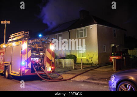 Dagenham, London, UK. 01st Nov, 2014. Dagenham, Conservatory fire causes significant damage to house during Fire Strike. Contingency fire crews operating under the Capital Guardian reduced service arrangements tackled the blaze and brought it under control in about an hour. The property was empty at the time of the fire. London Fire brigade contingency arrangements provide a significantly reduced fire cover using only 27 fire appliances and contracted staff who are not fully trained FireFighters. Credit:  HOT SHOTS/Alamy Live News Stock Photo