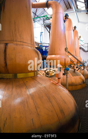 Copper stills for whisky process in traditional Still House part of Visitor Centre visitors tour at Tobermory Distillery, Isle o Stock Photo