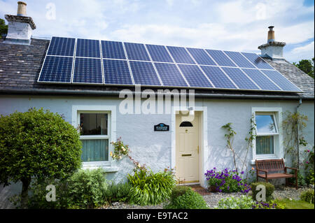 Solar panels environmental alternative energy on bungalow house at Salen Isle of Mull in the Inner Hebrides and Western Isles, W Stock Photo