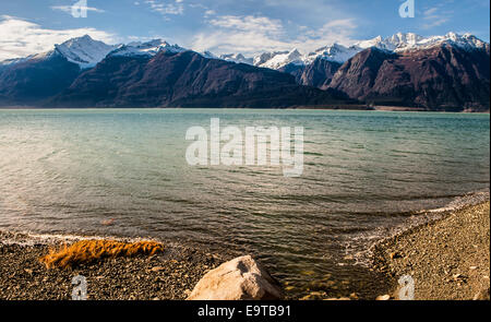 Mountains across the Chilkat Inlet in Southeast Alaska in fall with a dusting of snow. Stock Photo