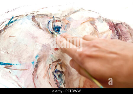 Hand of artist at work Stock Photo